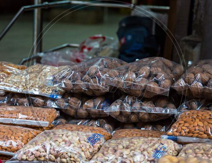Transparent Plastic Package Full Of Various Dried Fruits Stacked In Piles For Sale At Market, Dried Fruits, Asian Market - Image