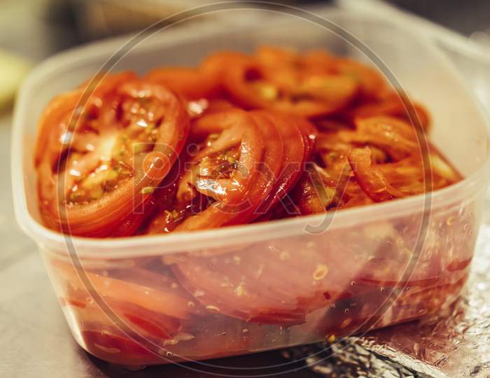 Fresh Juicy Sliced Red Tomatoes In White Plastic Container, Selective Focus Close Up