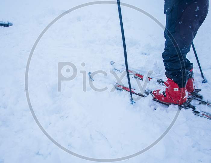 Man Skiing On A Snowy Day, Skiing Equipment Isolated On Pure White Background, Adventurous Activity - Image