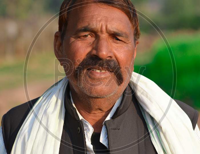 TIKAMGARH, MADHYA PRADESH, INDIA - FEBRUARY 08, 2020: A portrait of old unidentified indian man at his village.