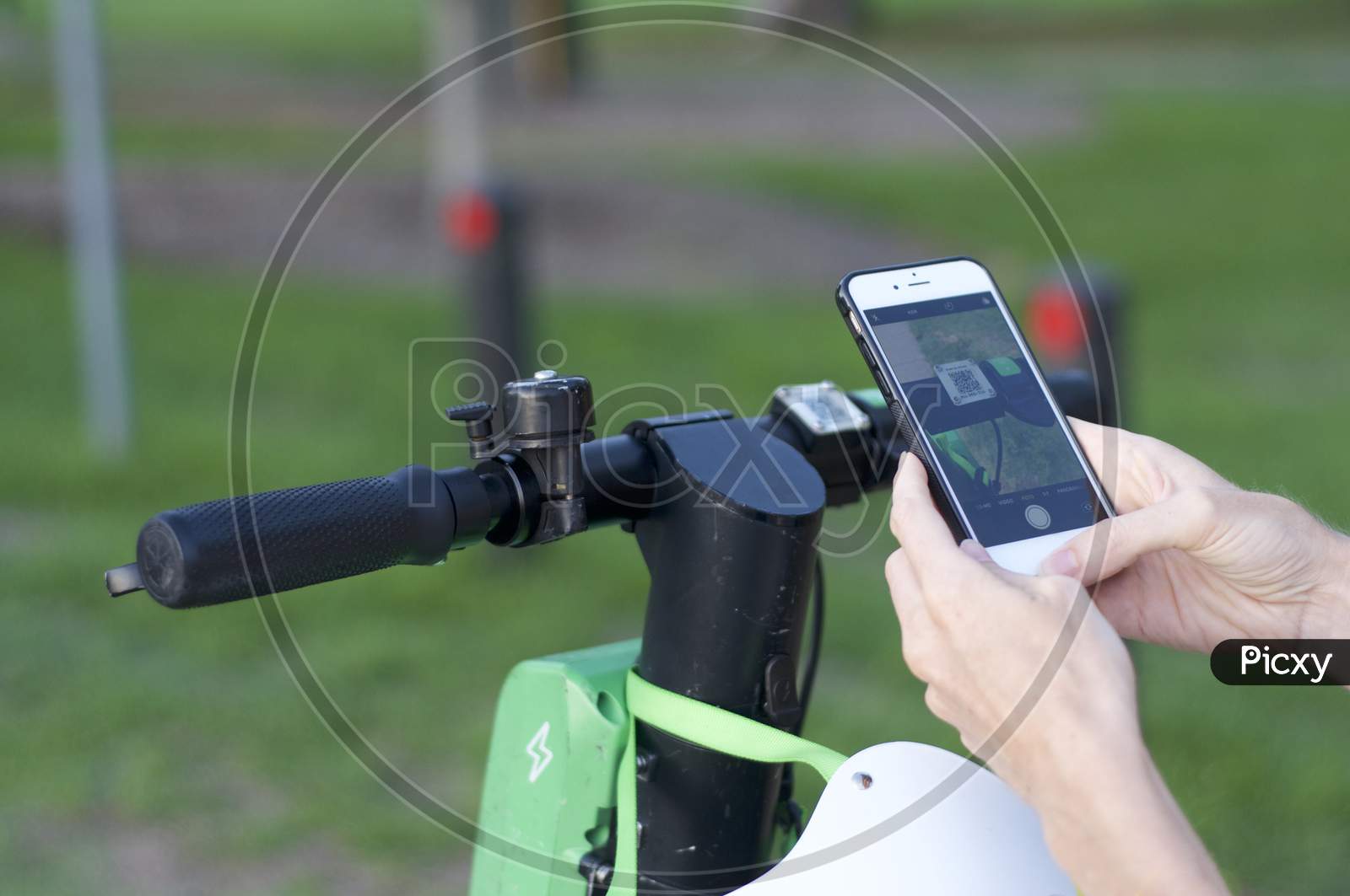 Lime E-Scooter Handlebar And Mobile Phone Ready For Scan