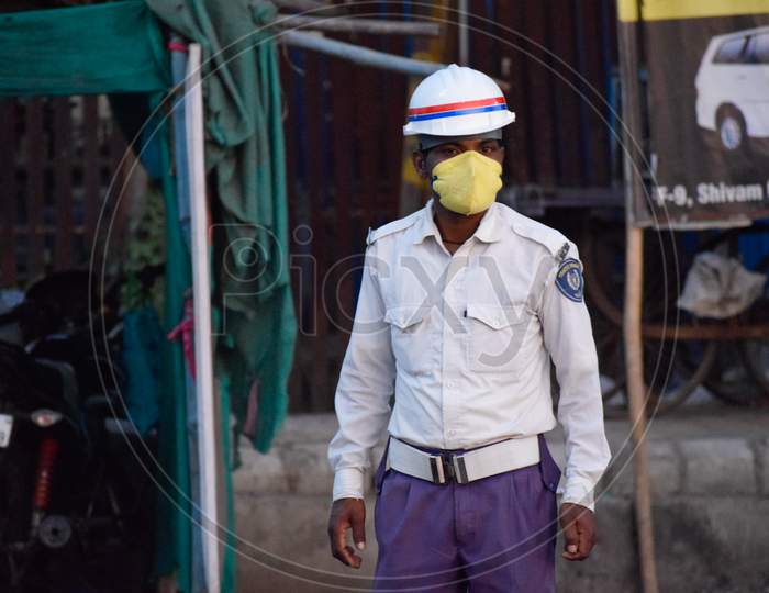 COVID 19 Corona Virus lockdown in India. Police on duty to stop people from roaming in the city and make them follow lockdown to prevent the spread of Corona. Protection from COVID 19. Corona warriors.