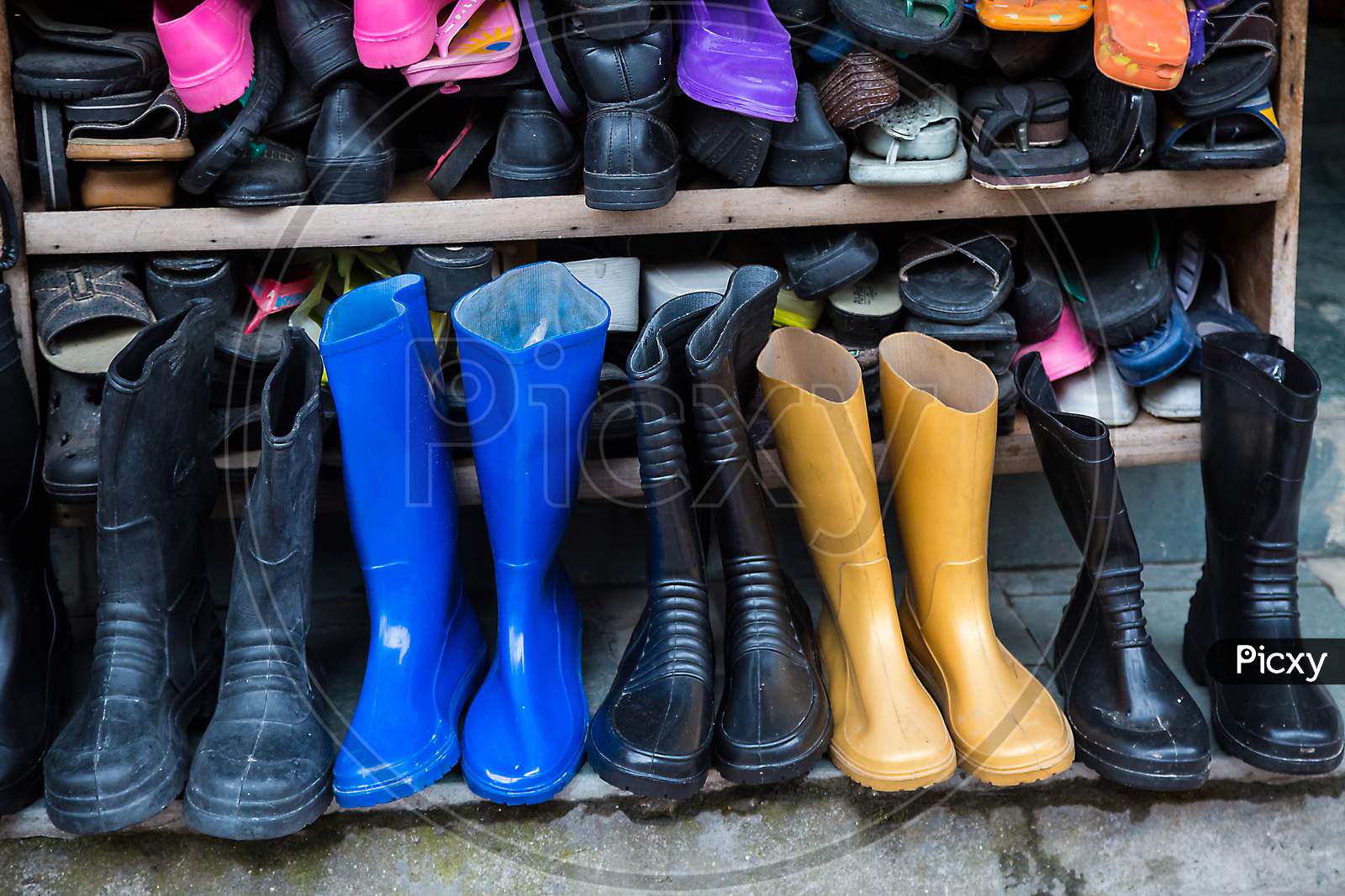 Rows Of Various Winter Boots, Shoes And Slipper, Shop - Image
