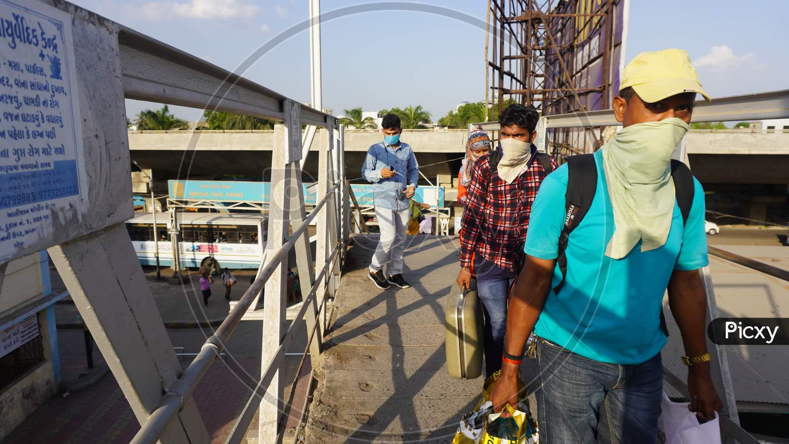 MIGRANT WORKERS. Indian migrant workers during COVID 19 Corona Virus nationwide lockdown returning back home special trains Bus Railway station. Police on duty.