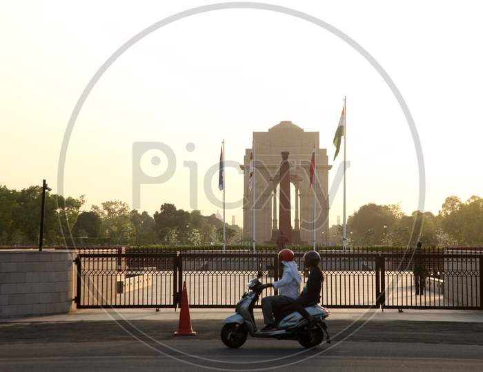 India Gate in New Delhi with Vehicles moving the foreground