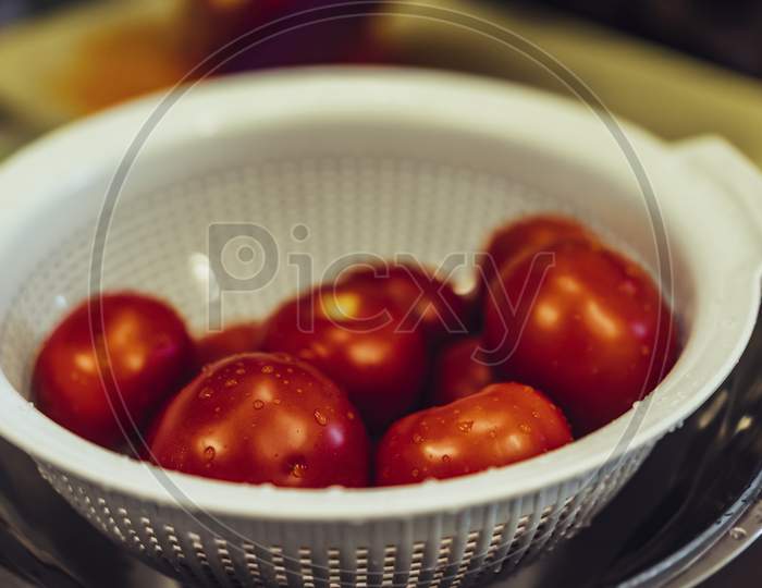 Fresh Red Tomatoes In White Plastic Bowl, Selective Focus Close Up