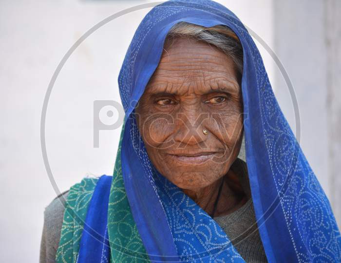 TIKAMGARH, MADHYA PRADESH, INDIA - FEBRUARY 08, 2020: Closeup portrait of an old indian woman at her village.