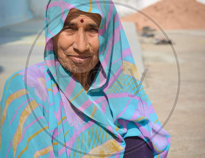 TIKAMGARH, MADHYA PRADESH, INDIA - FEBRUARY 08, 2020: A portrait of old unidentified indian woman at her village, An Indian rural scene.