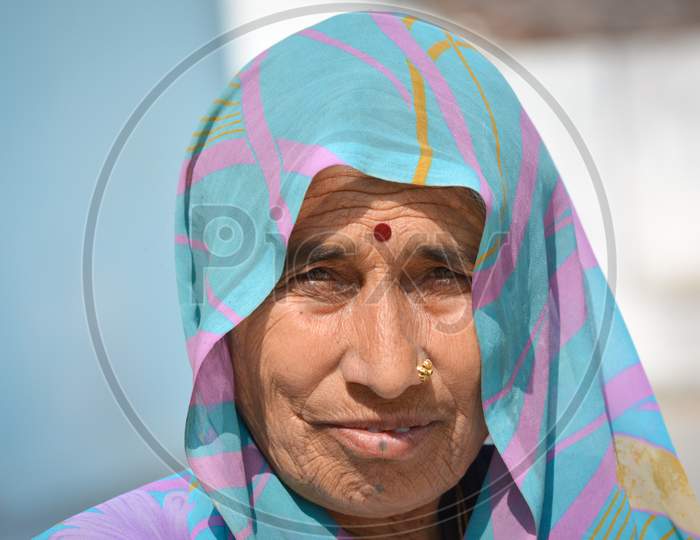 TIKAMGARH, MADHYA PRADESH, INDIA - FEBRUARY 08, 2020: A portrait of old unidentified indian woman at her village, An Indian rural scene.
