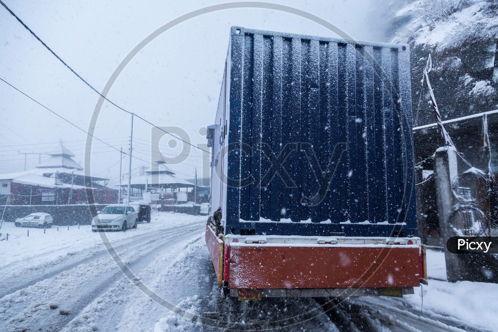Truck On Dangerous Snowy Road,High Way. Moving In Winter Season, Bad Weather And Transportation Concept - Image