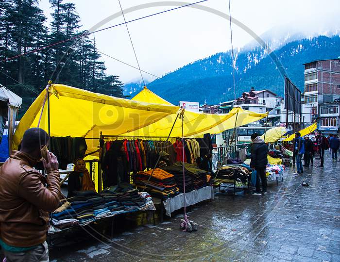 Manali , Himachal Pradsh, India - January 21, 2019 : People Walking And Enjoying Street Market Near Mall Road, Manali. Clothes Shop Selling A Winter Traditional Handmade Clothes - Image