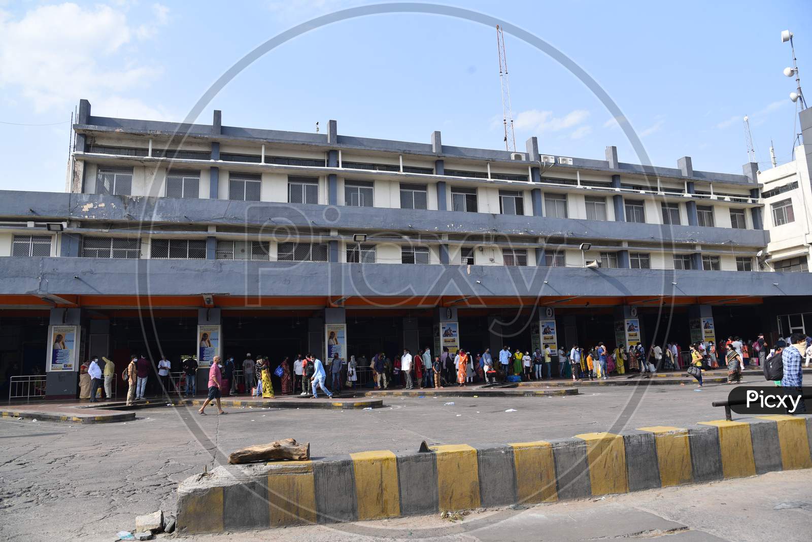 People wait for Inter District TSRTC Buses at Jubilee Bus Station amid travel relaxations announced by Telangana State Government, May 24, 2020