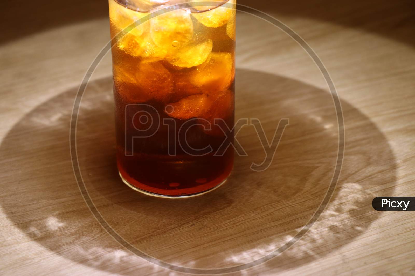 Iced Cold Drink In A Glass On Wooden Background