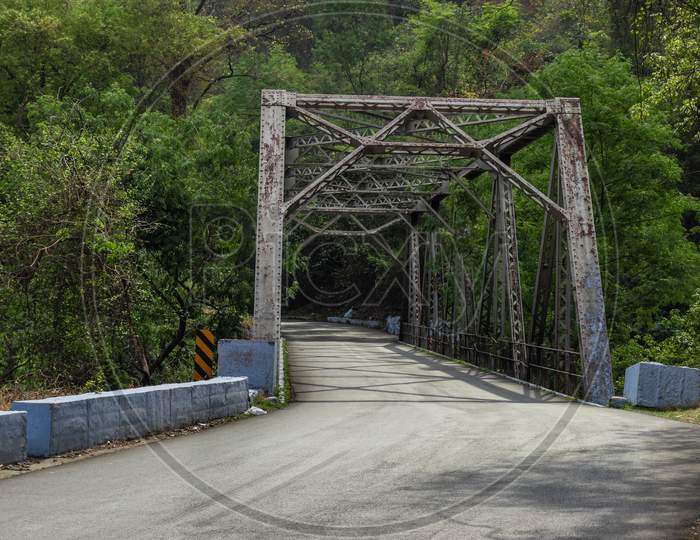 Isolated Iron Bridge In Hills