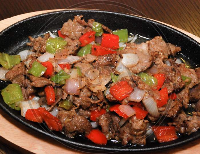Fried Beef With Green And Red Bell Pepper And Onion