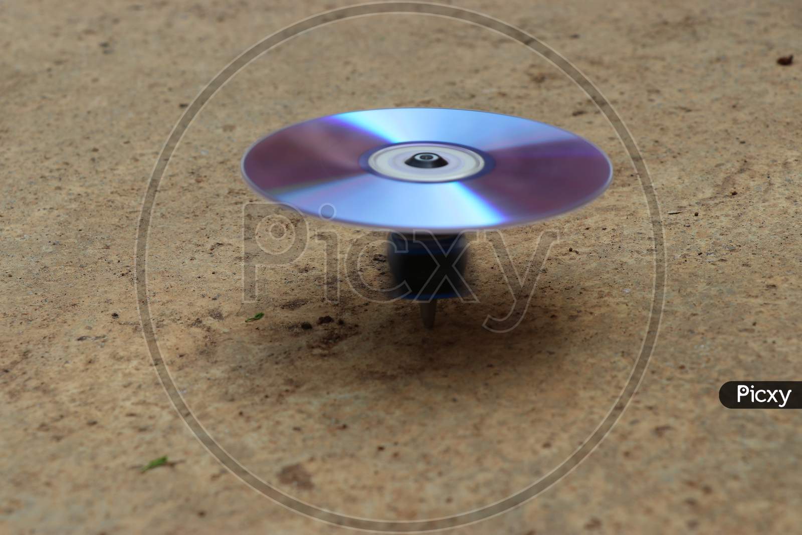 Gyroscope Top Made From Cd Drive And Motor Spinning On Ground