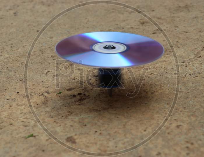 Gyroscope Top Made From Cd Drive And Motor Spinning On Ground