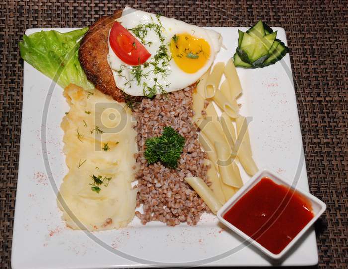 Fried Egg With Cutlet And Garnish