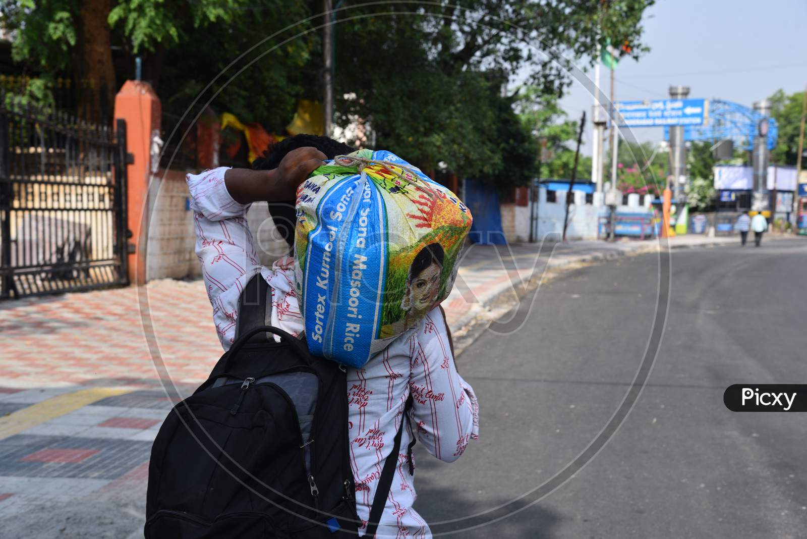 a man carries his luggage towards Secunderabad Railway Station, Hyderabad, May 24, 2020.