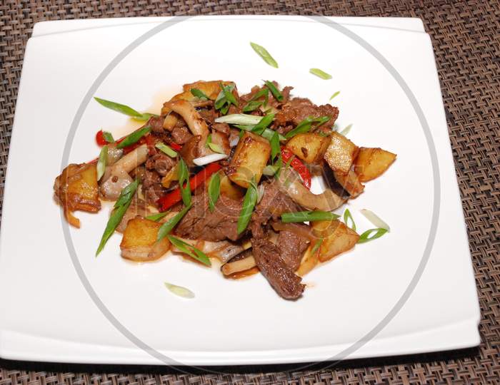 Fried Beef With Green Onion, Mushrooms And Potatoes