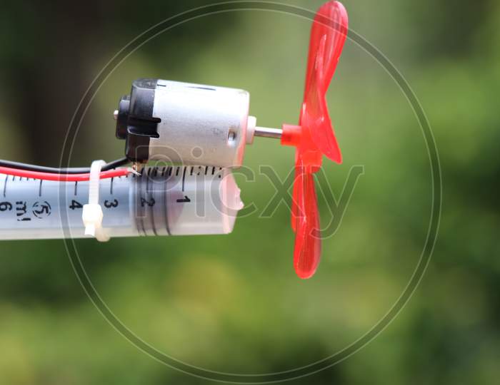 Dc Motor With Plastic Propeller Attached To Its Shaft Which Is Used As Fan