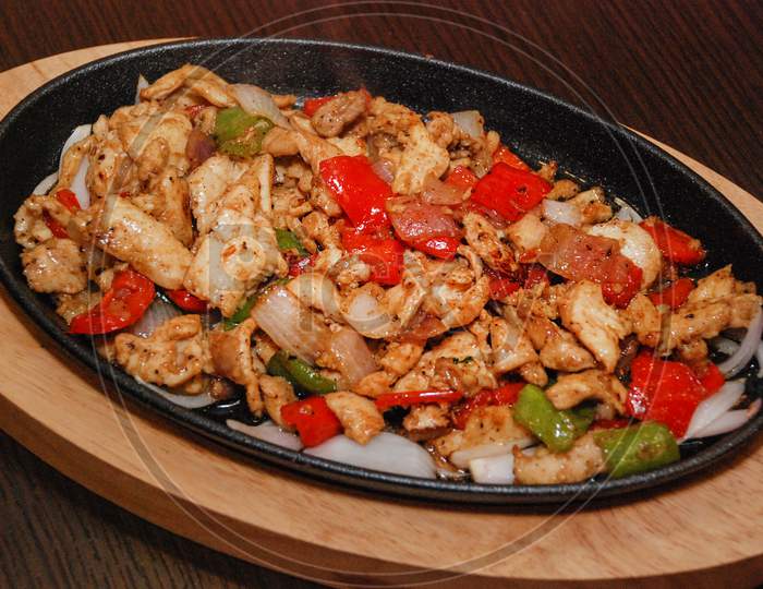 Fried Chicken With Green And Red Bell Pepper And Onion