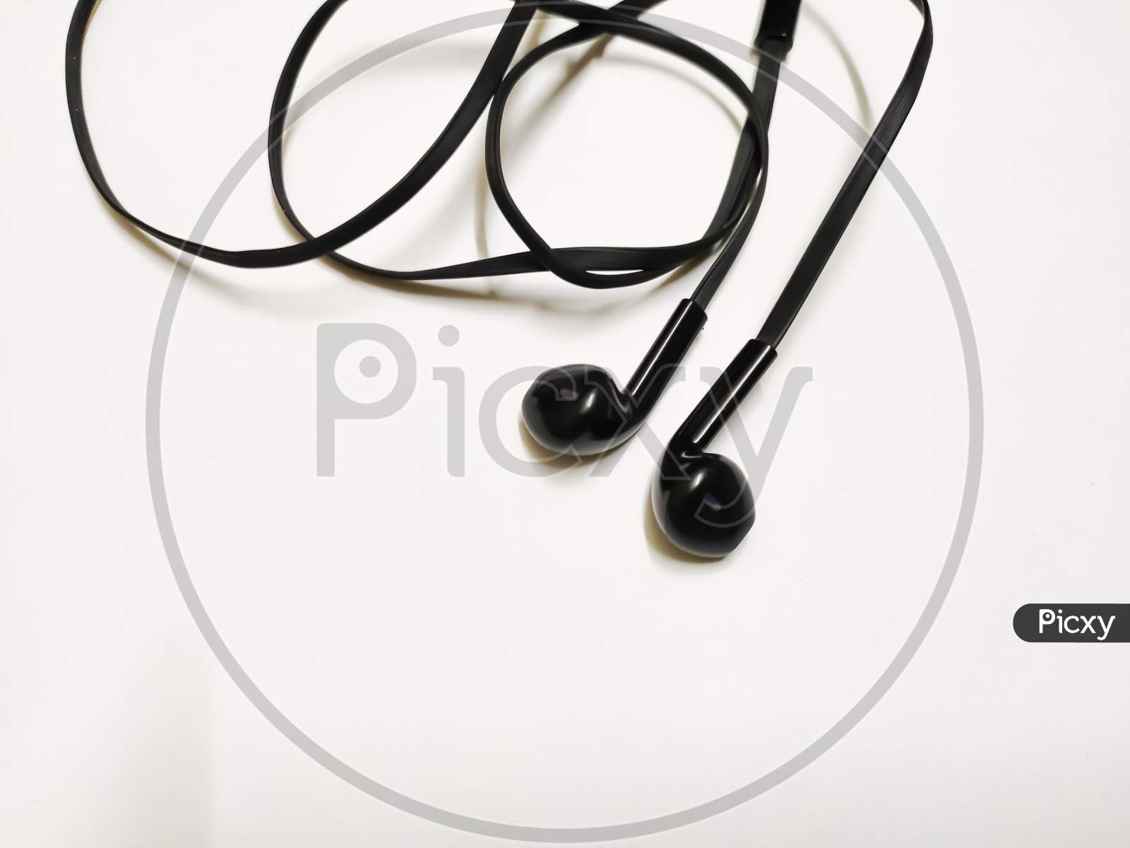 Top View Of Black Earphone Isolated On White Background With Space For Text