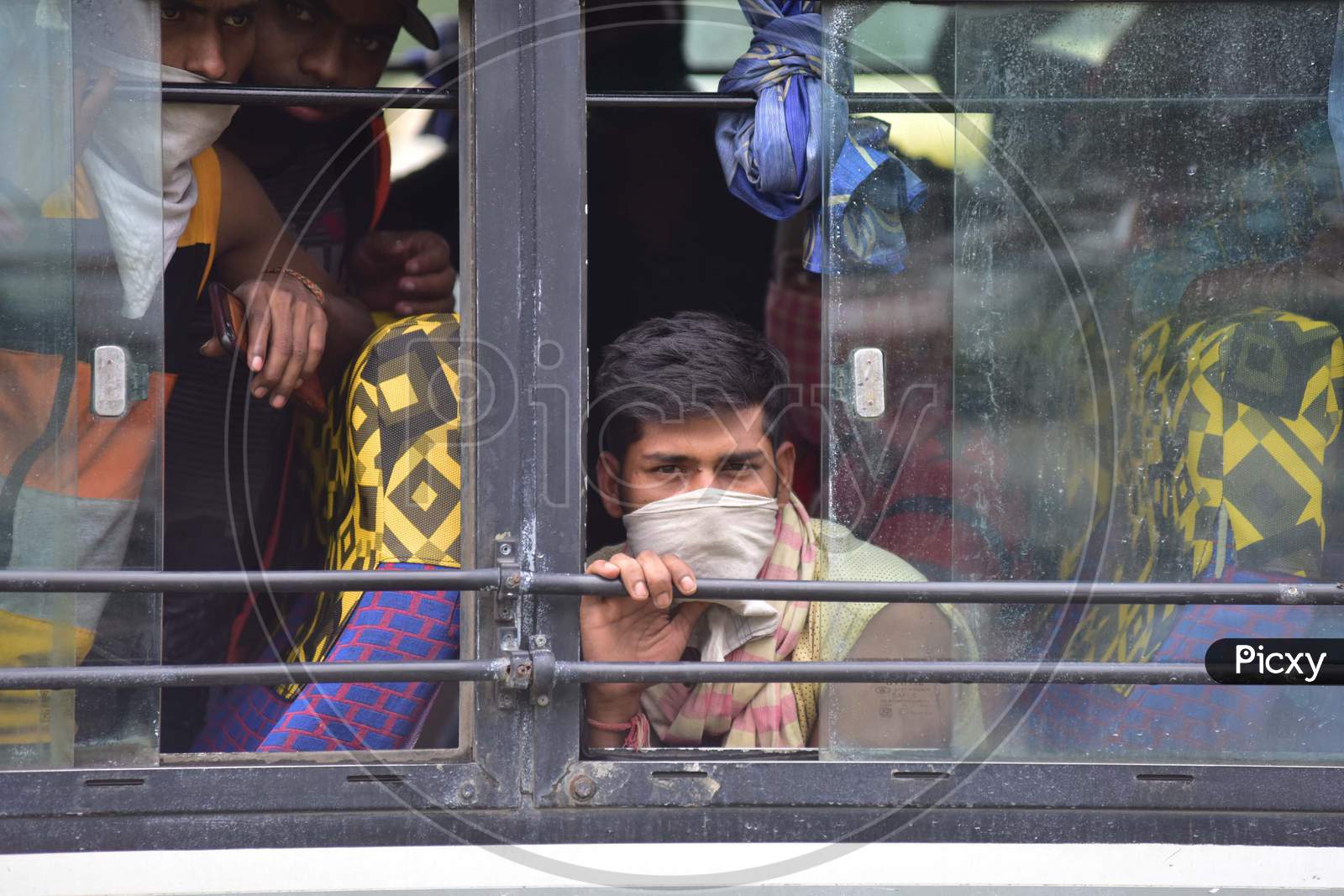 Migrants Arriving From Kerela  Via Train Boarding  A Bus For Quarantine Center   During Extended Nationwide Lockdown Amidst Coronavirus or COVID-19 Pandemic in Nagaon  on  may 24,2020