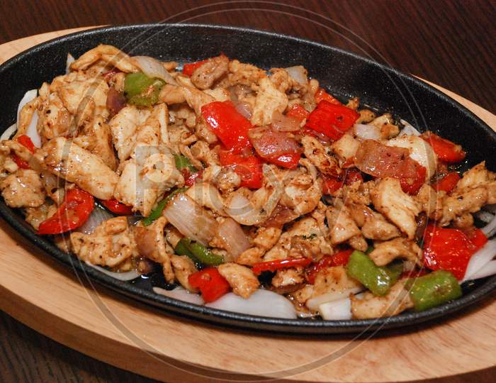 Fried Chicken With Green And Red Bell Pepper And Onion