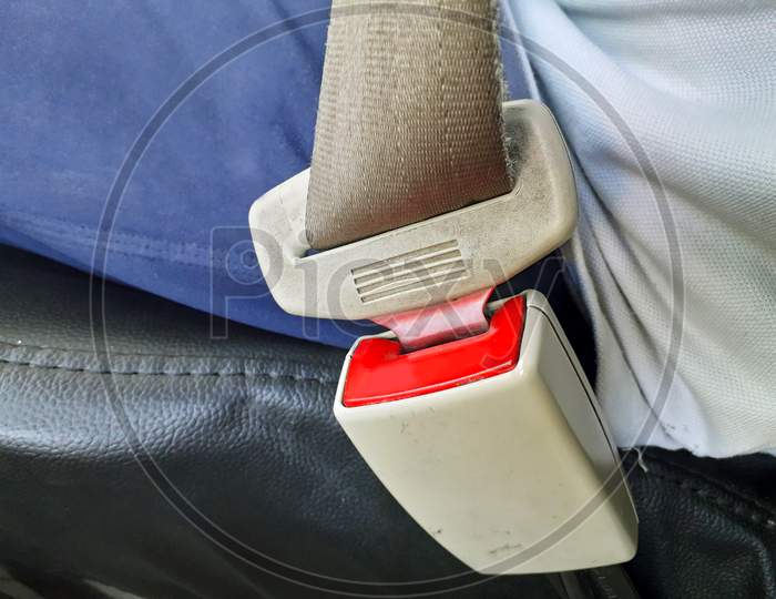 A Male Person Wearing Seat Belt While Driving Safe And Knows Driving Rules