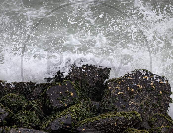 Sea Waves Splash On Seaside Rocks