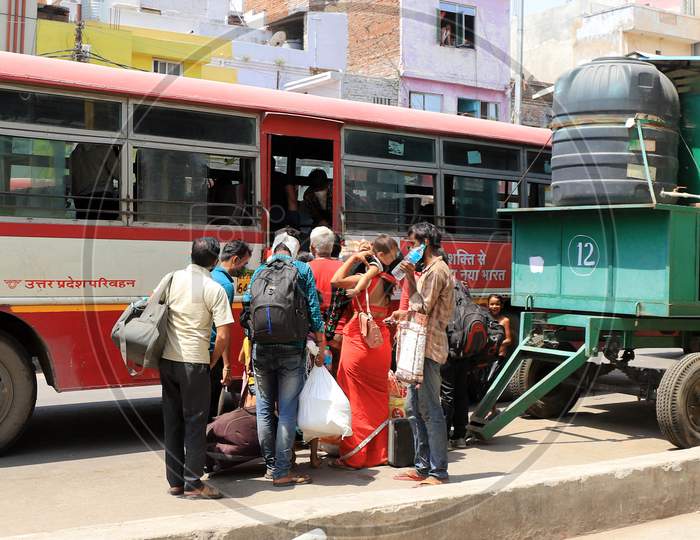 Migrants From Mumbai Arrived By A Special Train Board Buses To Their Native Villages During Extended Nationwide Lockdown Amidst Coronavirus Or COVID-19 Pandemic In Prayagraj, May 25, 2020.