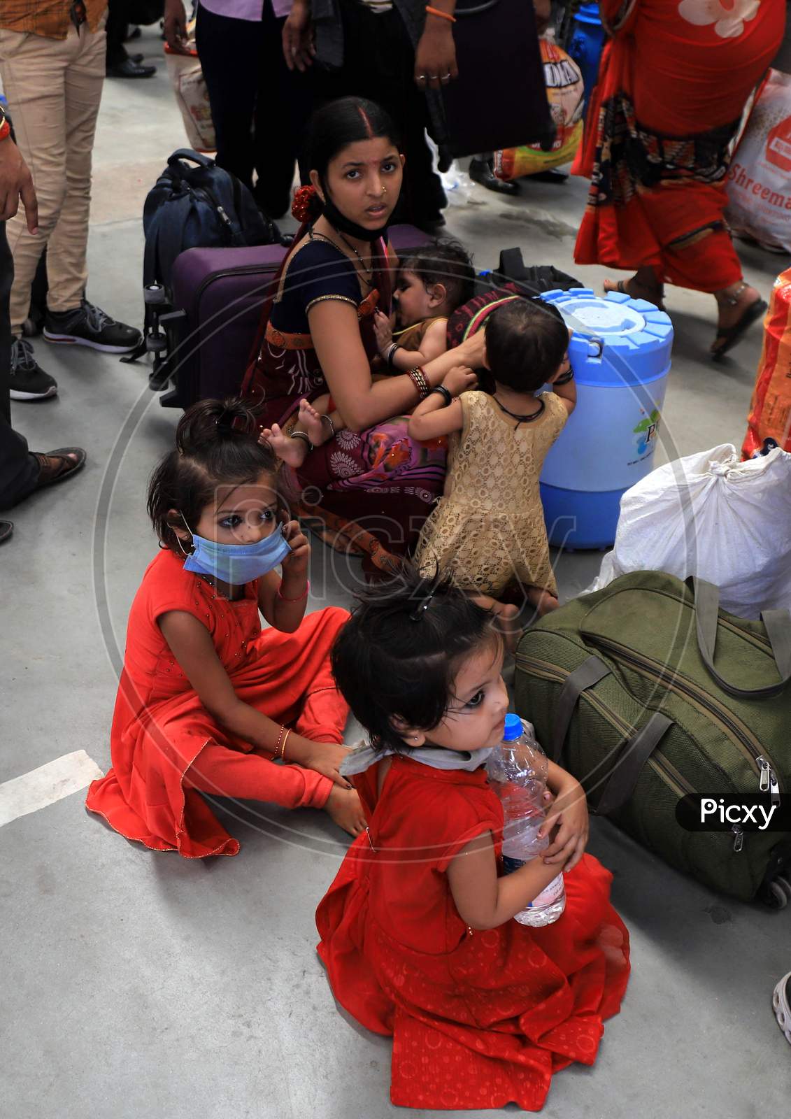 Migrants From Mumbai Arrived By A Special Train Wait to Board Buses To Their Native Villages During Extended Nationwide Lockdown Amidst Coronavirus Or COVID-19 Pandemic In Prayagraj, May 25, 2020.
