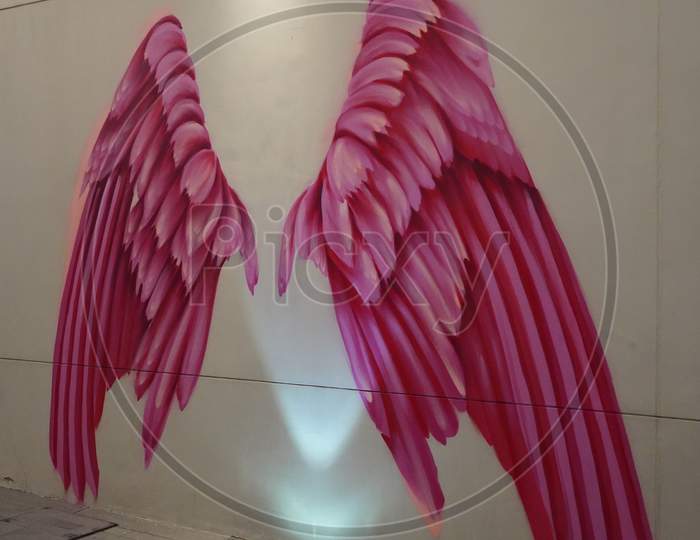 Dubai Uae December 2019 Pink Wings On Wall. Large Human Sized Pink Angel Wings Painted. Painted Walls, Graffiti Art, And Sculptures Adorn The Streets.