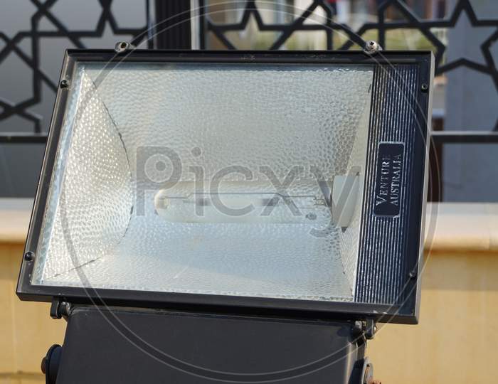Dubai Uae - November 2019: Close Up Outdoor Led Lamp On The Yard. Large Outdoor Light For Building Coloring. Led Flood Light, Spot Light Which Lights Up A Building. Electrical Light In The Night.