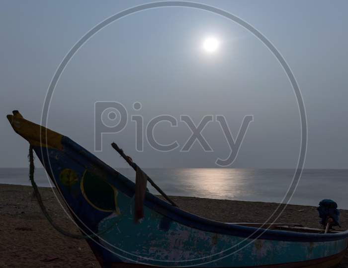 Moon Light At Beach With Fisherman Boat