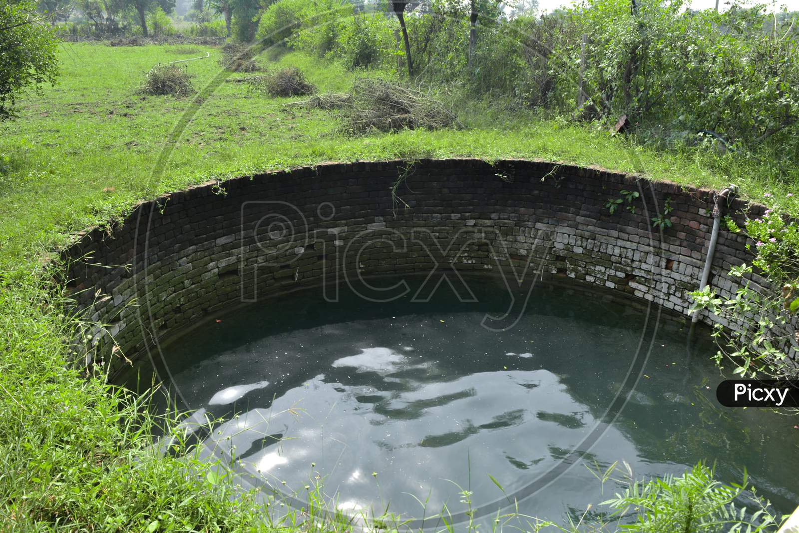 An old water well in a village, rural scenery