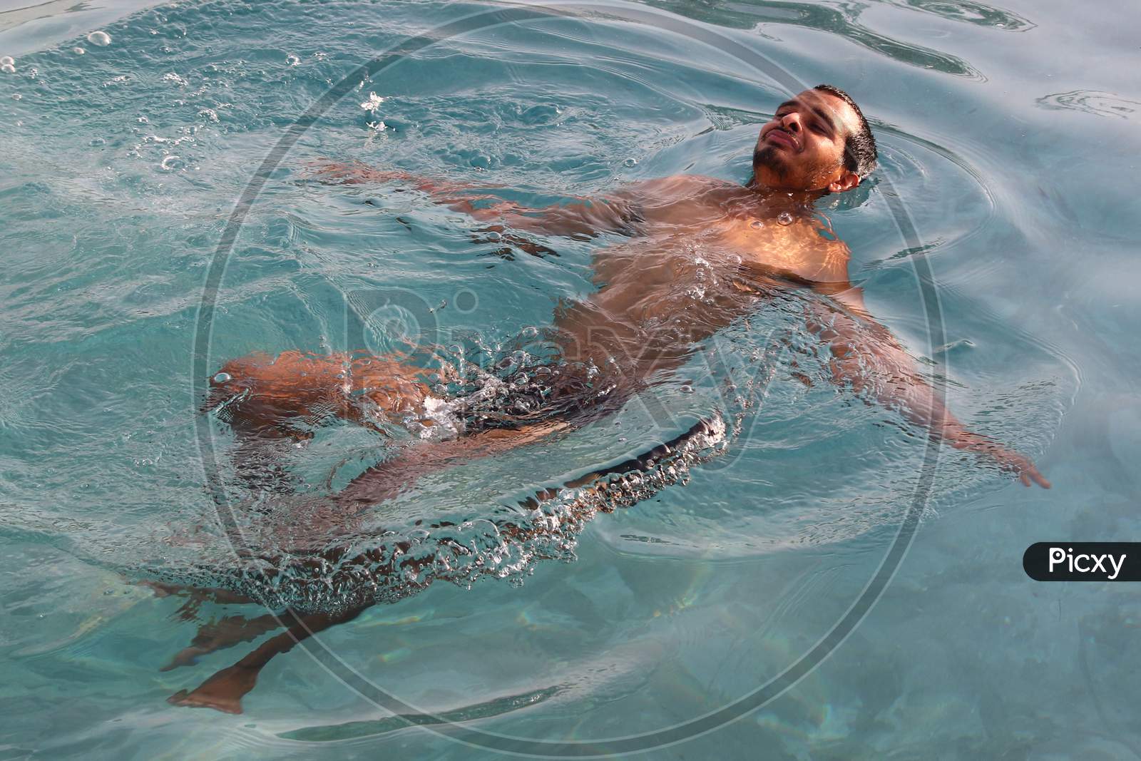An Indian Man Cools Off Inside a Swimming Pool On A Hot Summer Day In Ajmer, Rajasthan, India On 24 May 2020.