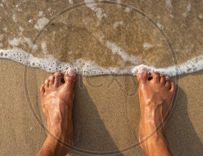 Human Feet Feeling Nature Isolated On Sandy Beach