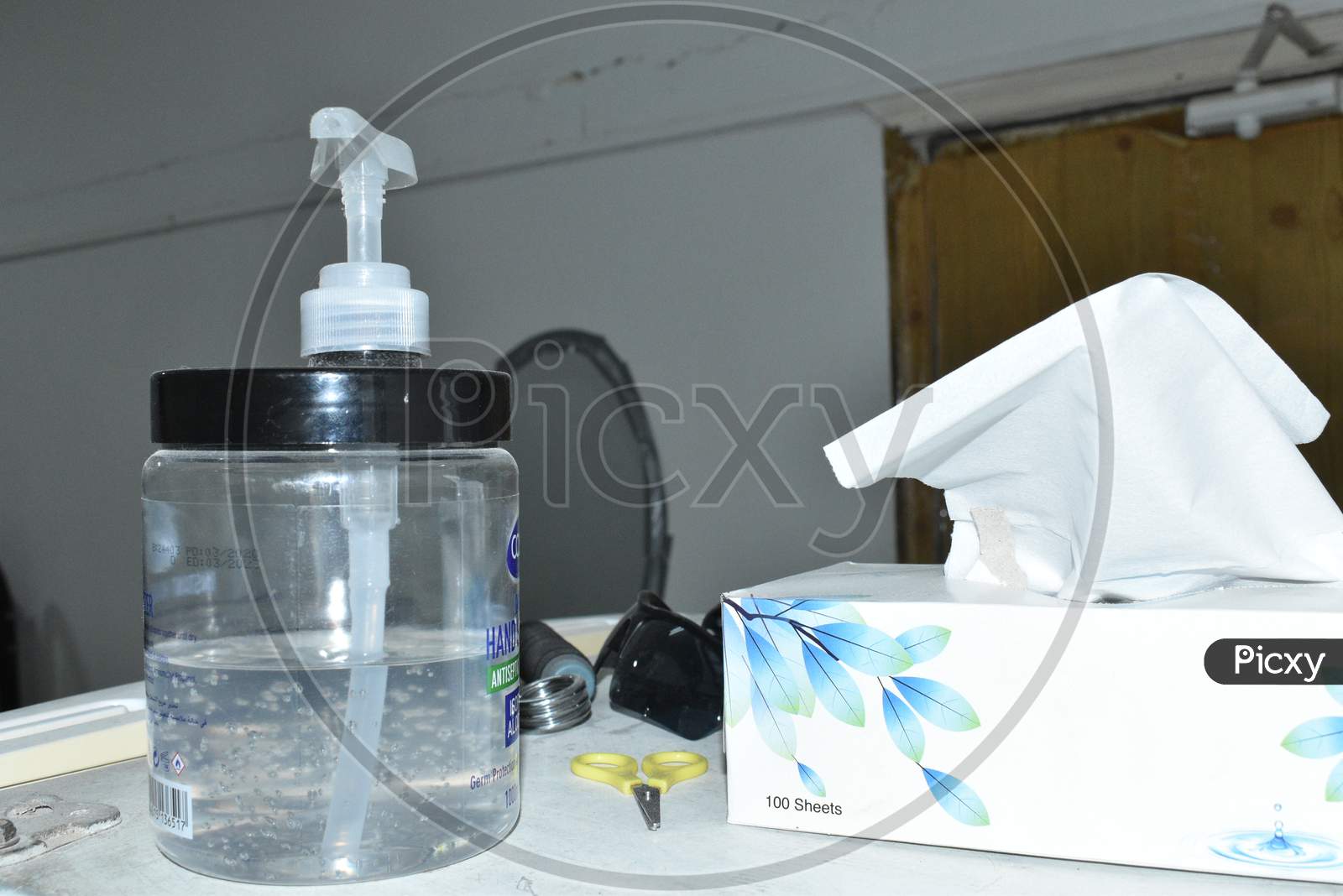 Tissue Paper And Alcohol Sanitizer Hand Gel For Cleaning And Protecting Corona Virus.
