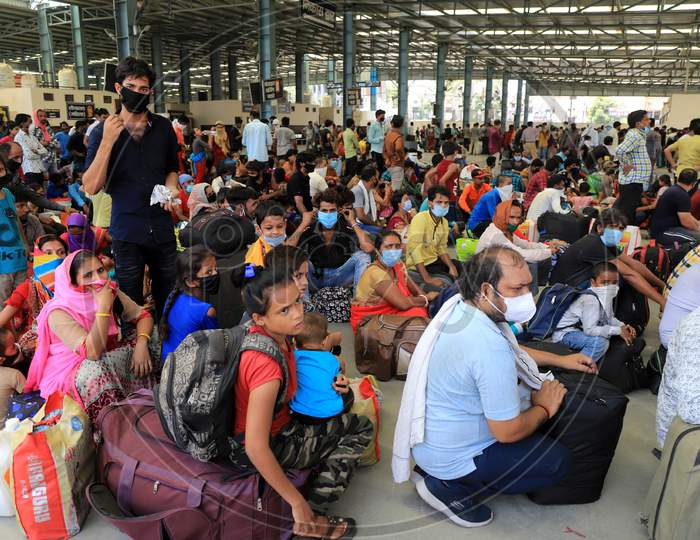 Migrants Who Arrived By A Special Train Wait To Board Buses For Their Native Villages During Extended Nationwide Lockdown Amidst Coronavirus Or COVID-19 Pandemic In Prayagraj, May 25, 2020.