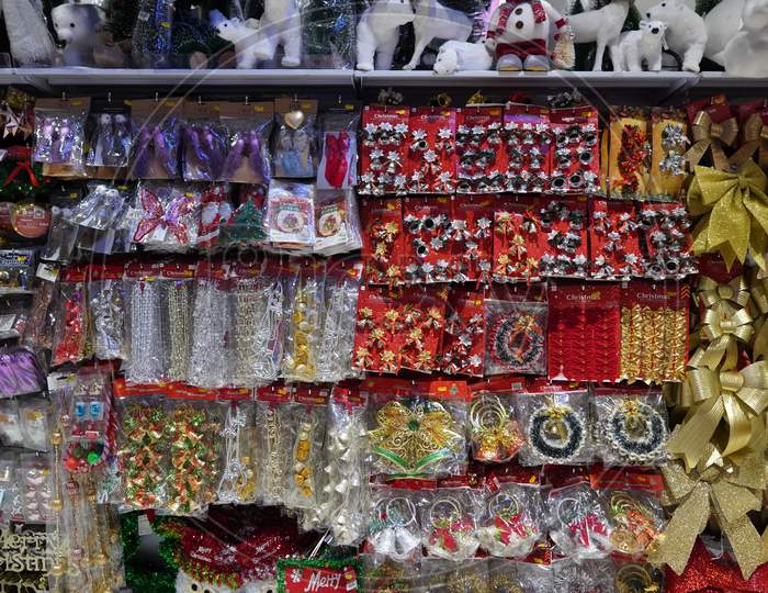Christmas Market. Christmas Decoration Shelves Filled With Tree Ornaments, Shiny Baubles, Gift Stockings, Antler Headbands, Novelty Decorations, Signs & Festive Animals - Dubai Uae December 2019