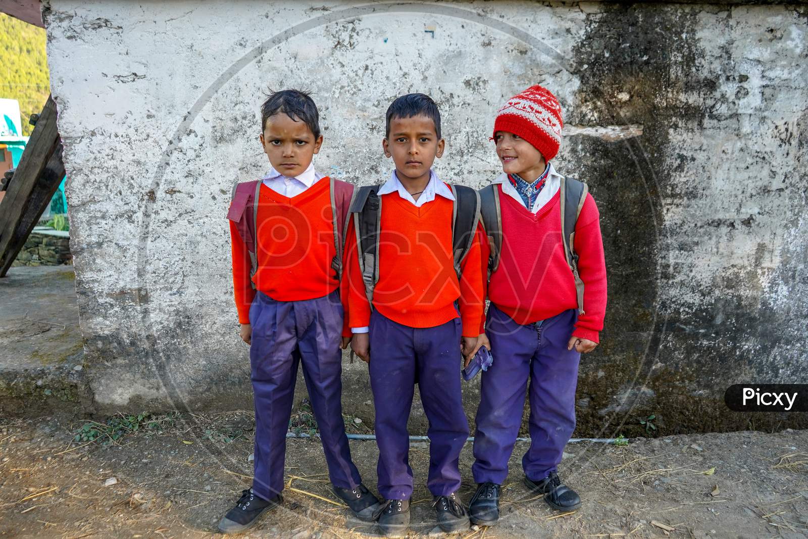 Almora, Uttrakhand / India- May 25 2020 : Group Of Young Kids Returning From School With Red And Blue Uniform
