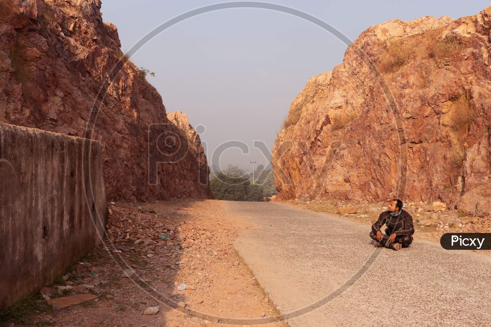 Motorcycle Rider Sitting On Tarmac Road Isolated