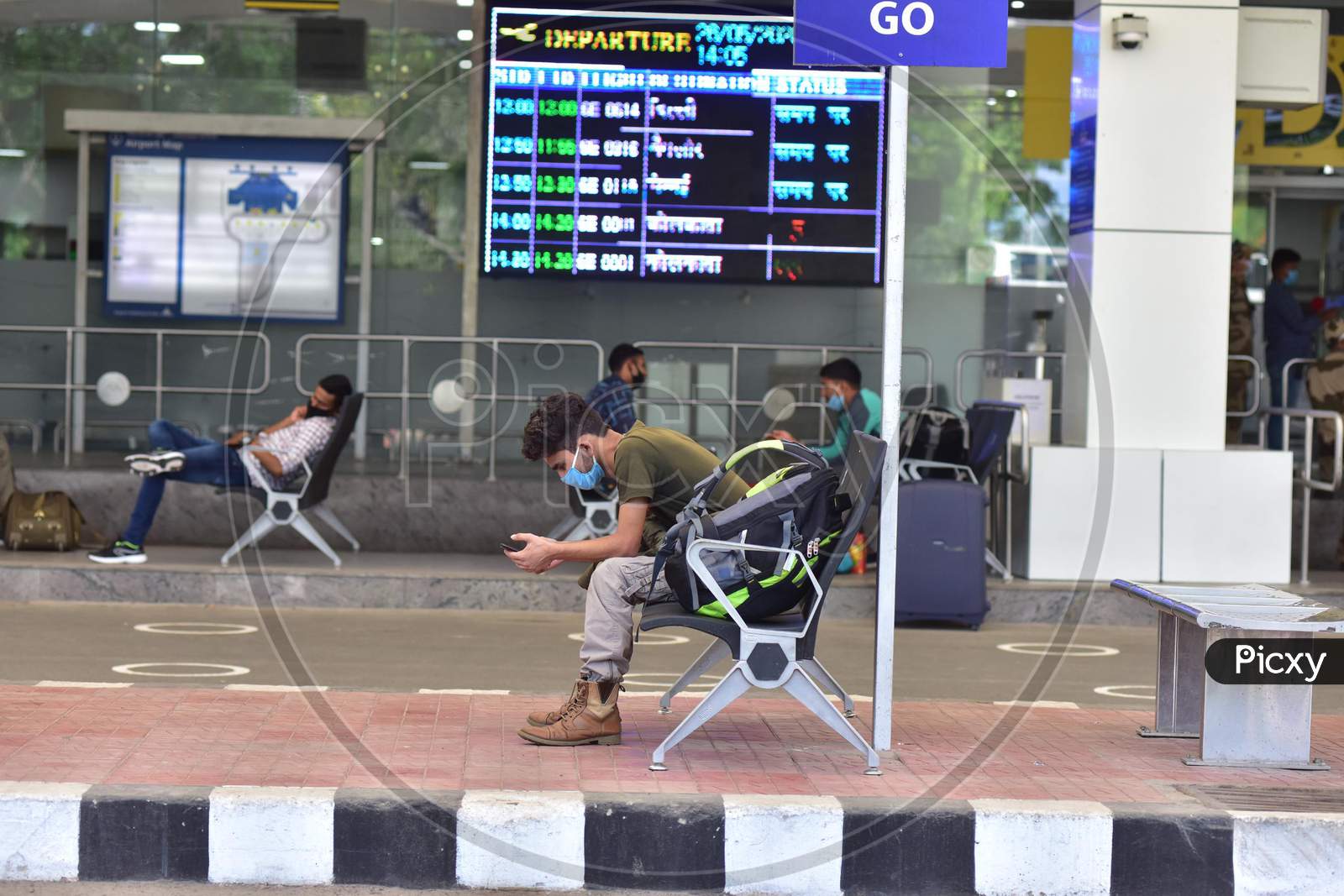 Passengers wait At Lokpriya Gopinath Bordoloi International Airport, Following The Resumption Of Domestic Flights, In Guwahati On May 26,2020.