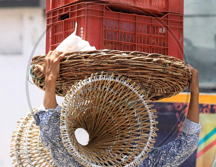 A Vendor Carries Baskets On His Head On A Hot Weather day In Prayagraj, May 26, 2020.