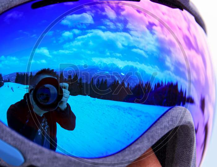 Photographer And Camera Reflected In Goggles