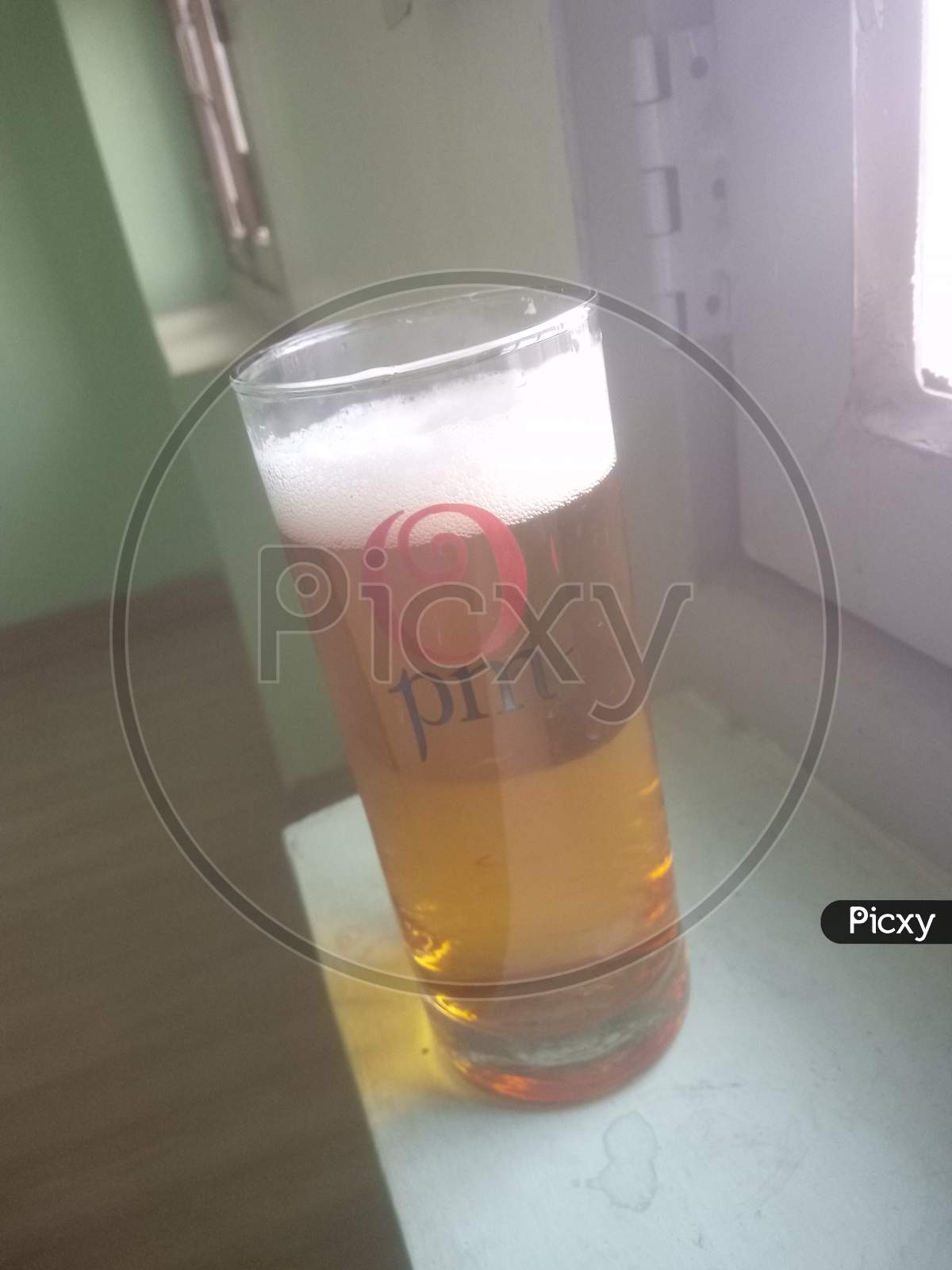 Drinking beer in wisky glass