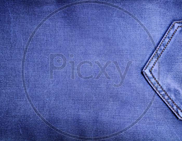 Photo with denim texture fabric. Jeans pocket texture, denim background, old style jeans pocket background