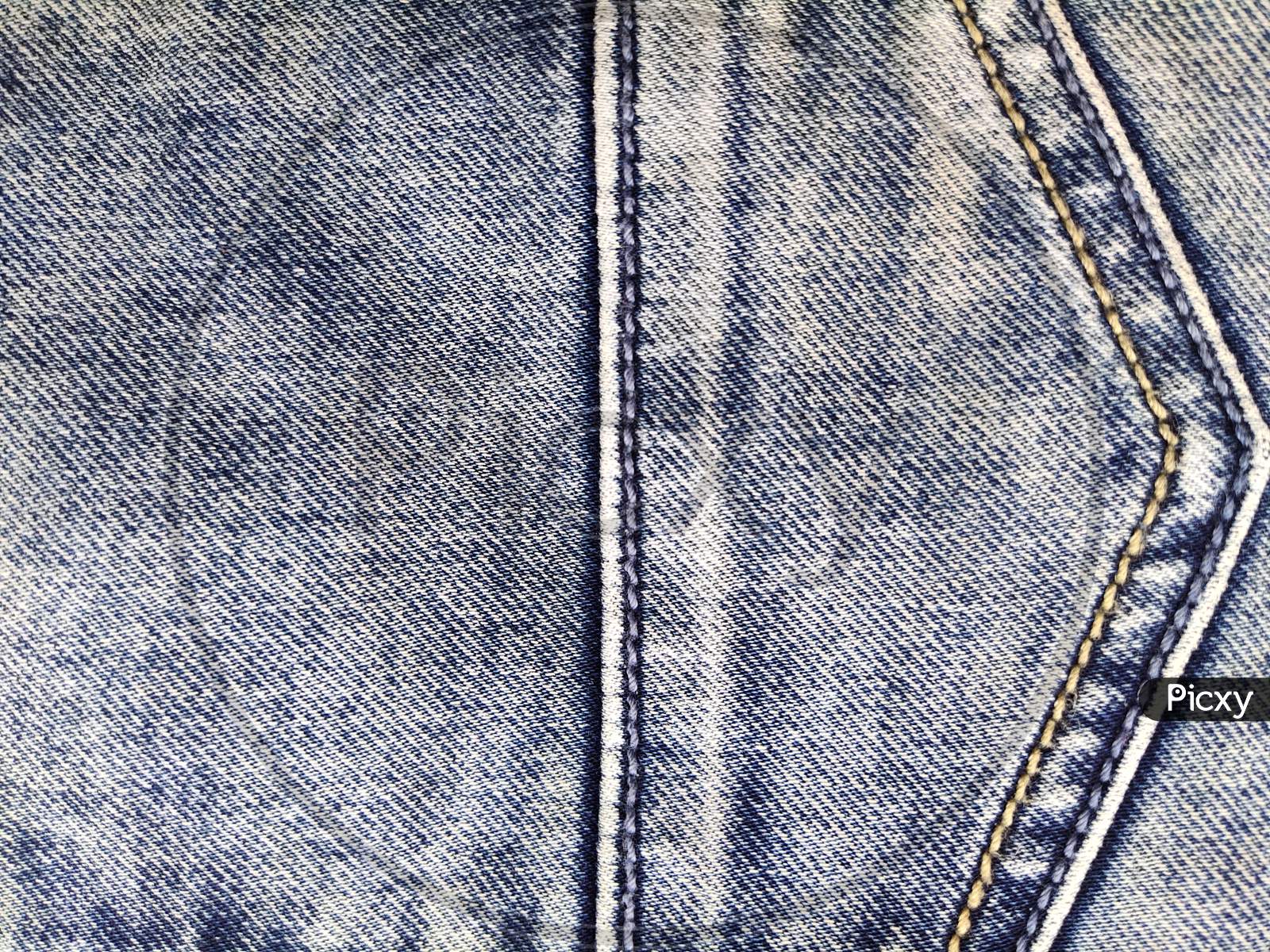 Photo with denim texture fabric. Jeans pocket texture, denim background, old style jeans pocket background